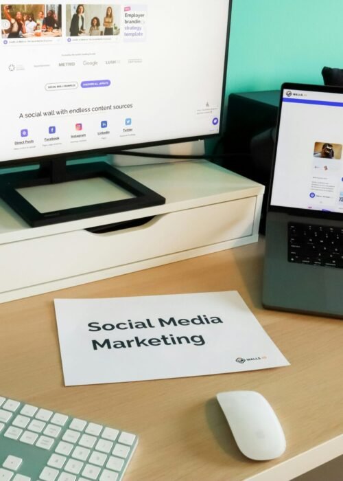 Stylish workspace with laptop and monitor for social media marketing.